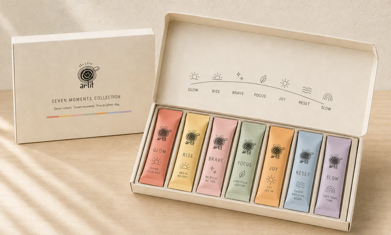 ARTIT Seven Moments gift box open on a table with seven coloured sachets in a row